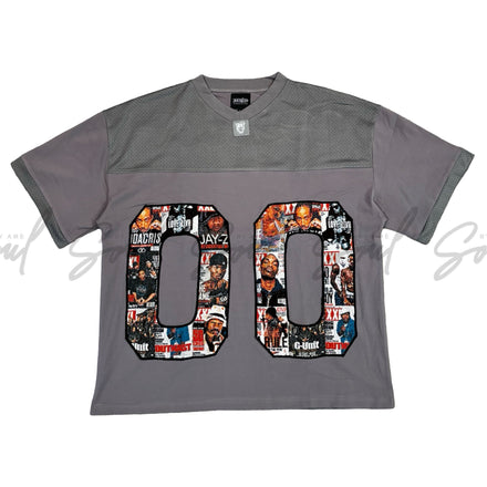 Gray t-shirt with the number ’00’’ filled with colorful comic book-style images.