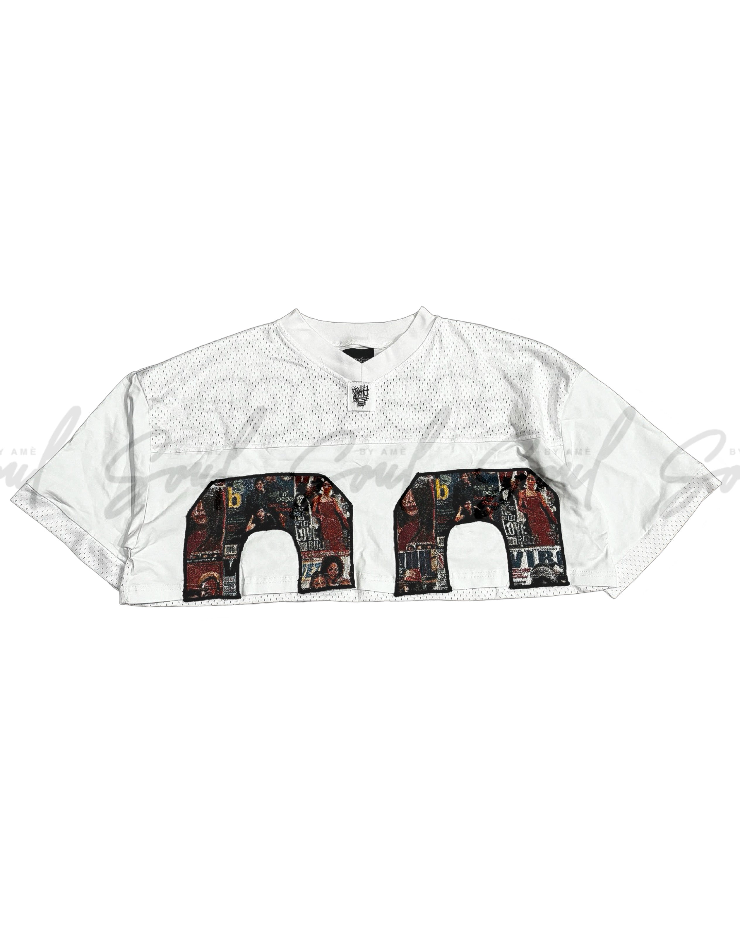 White sports jersey with decorative number design featuring various images and patterns.