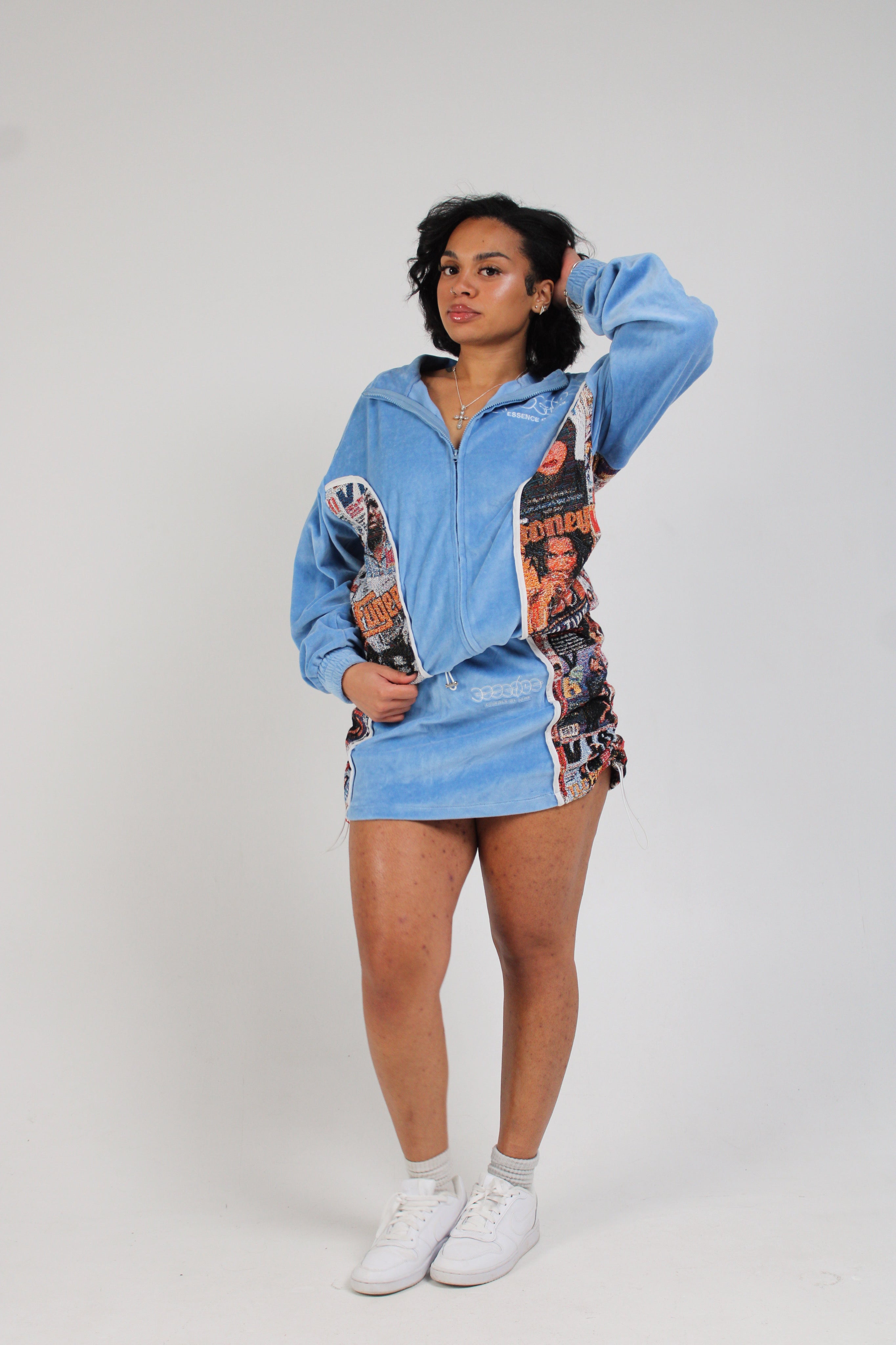 Light blue zip-up hoodie dress with decorative side panels.