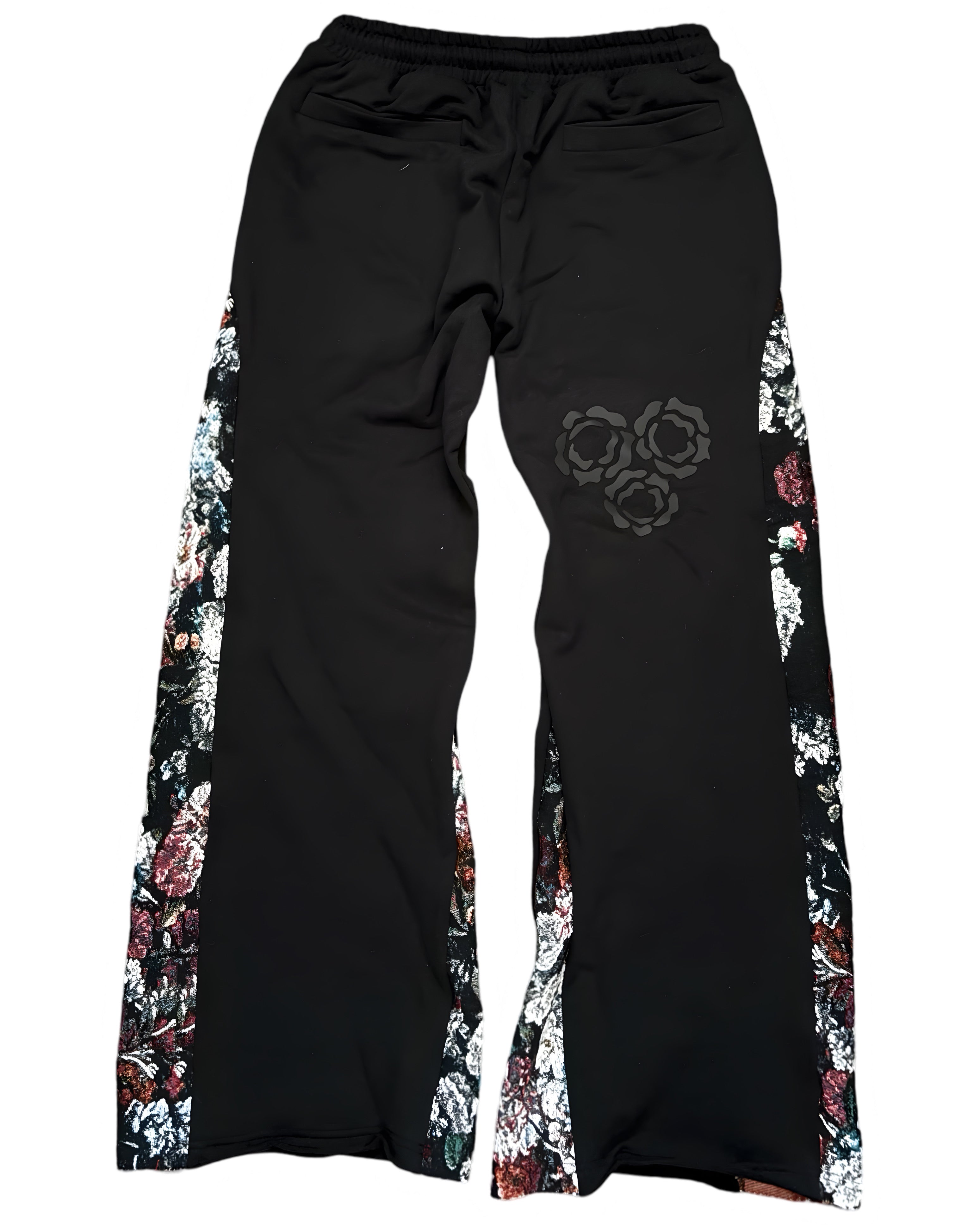 Black pants with floral side panels and a decorative circular design on the thigh.